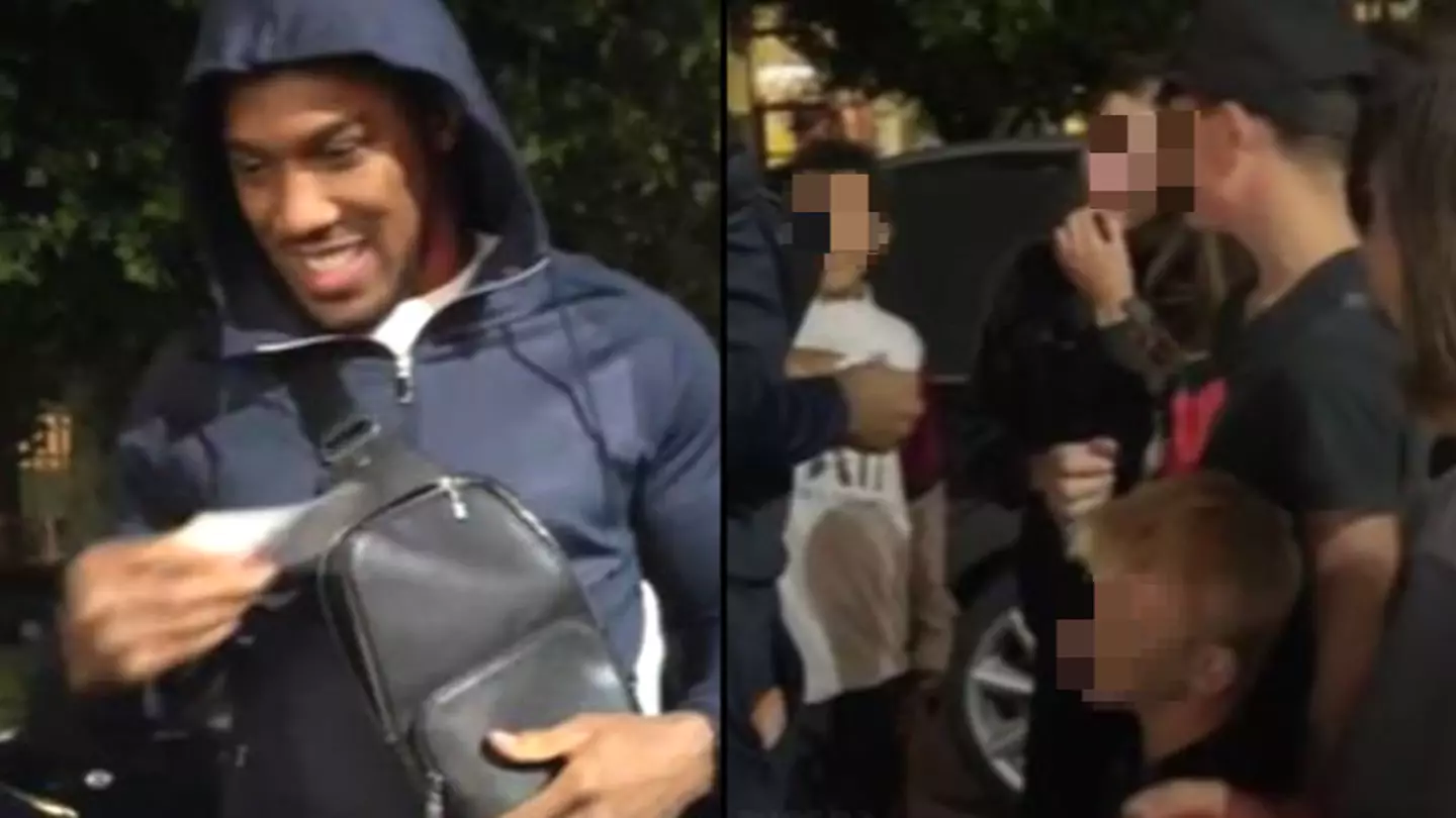 Anthony Joshua gives wads of cash to young kids waiting to meet him