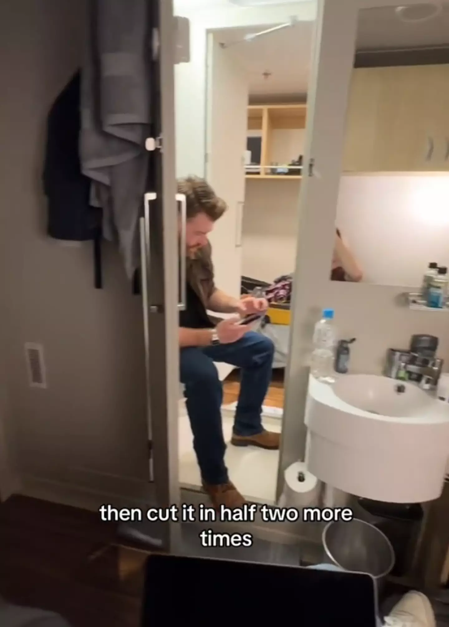 The tiny shared bathroom with both access doors open (TikTok / @bryanjamescruises)