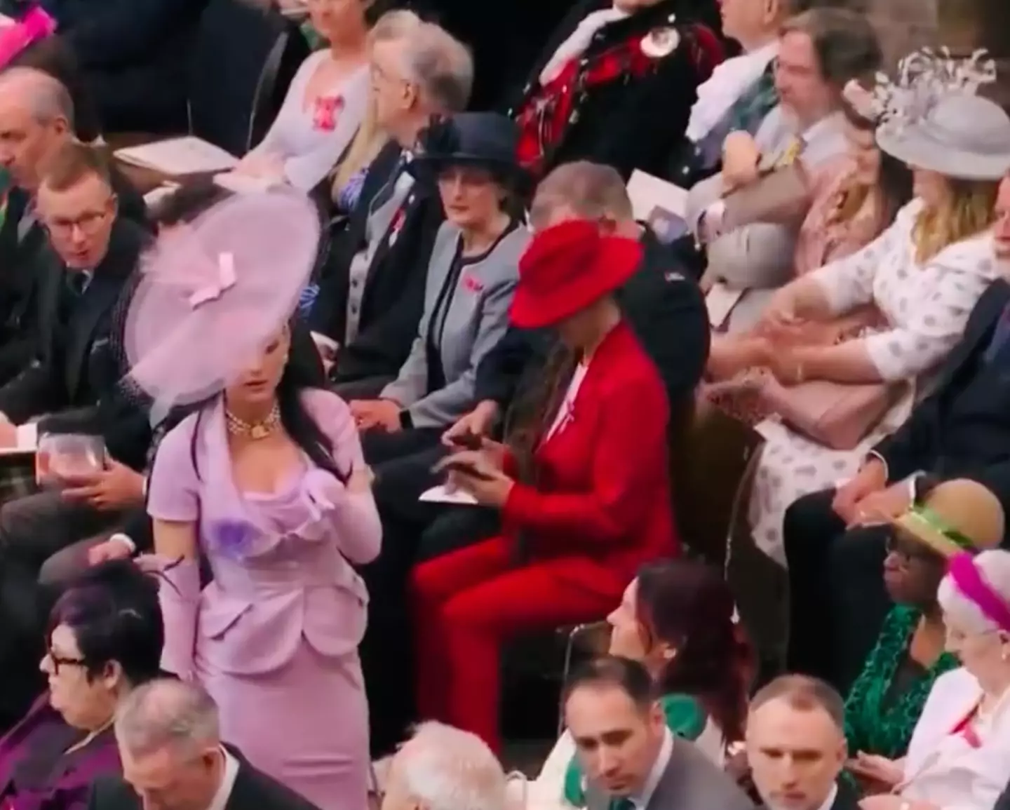 "How can she find her seat when she has fishing net over her head?"