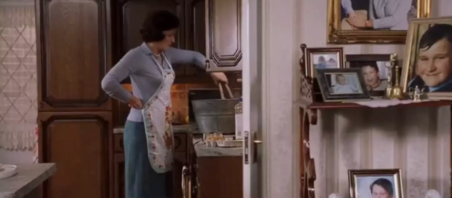 Aunt Petunia is seen looking pretty busy in the background during one of the first scenes in the first ever film. (Warner Bros.)