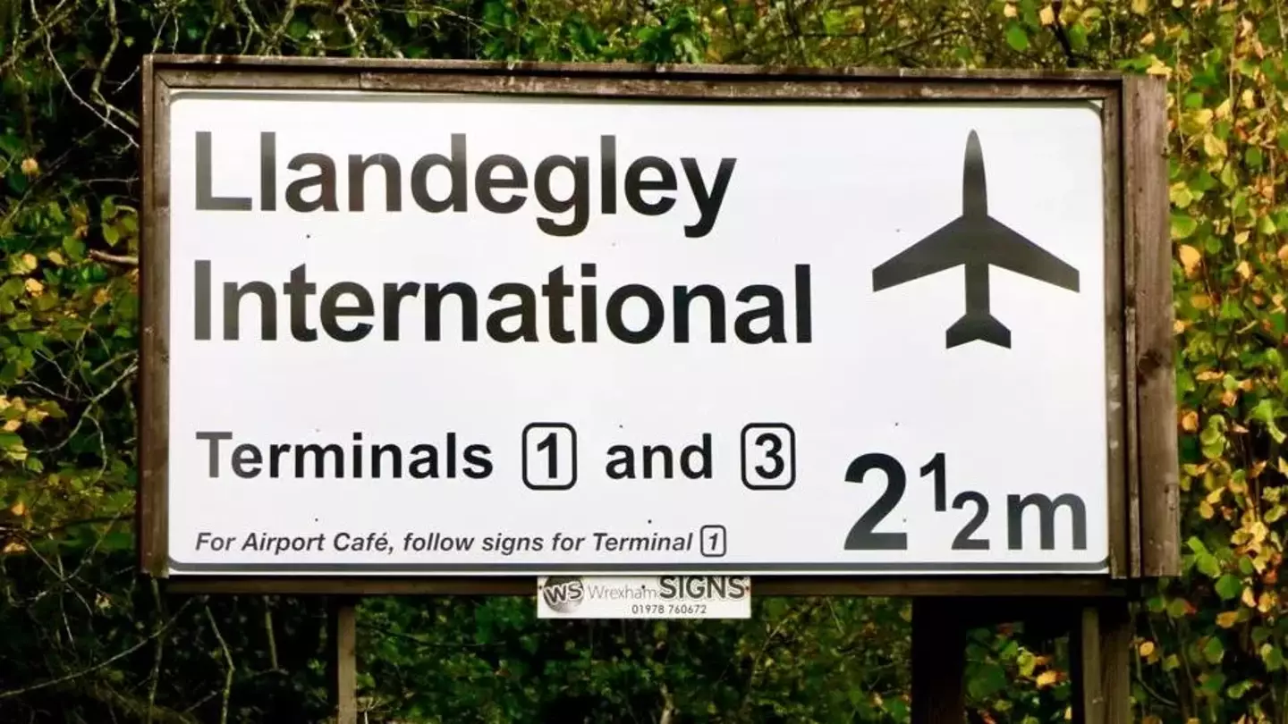A man who's spent £25,000 on a very realistic, fake airport sign, has decided to take it down.