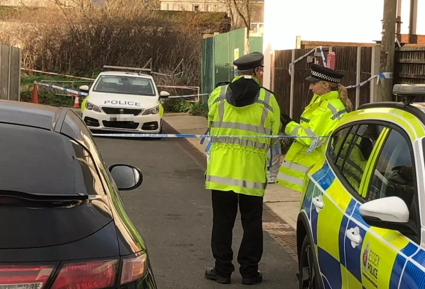 The police cordon in Hillman Avenue, Jaywick, Essex, after a 68-year-old was savaged to death by two dogs.