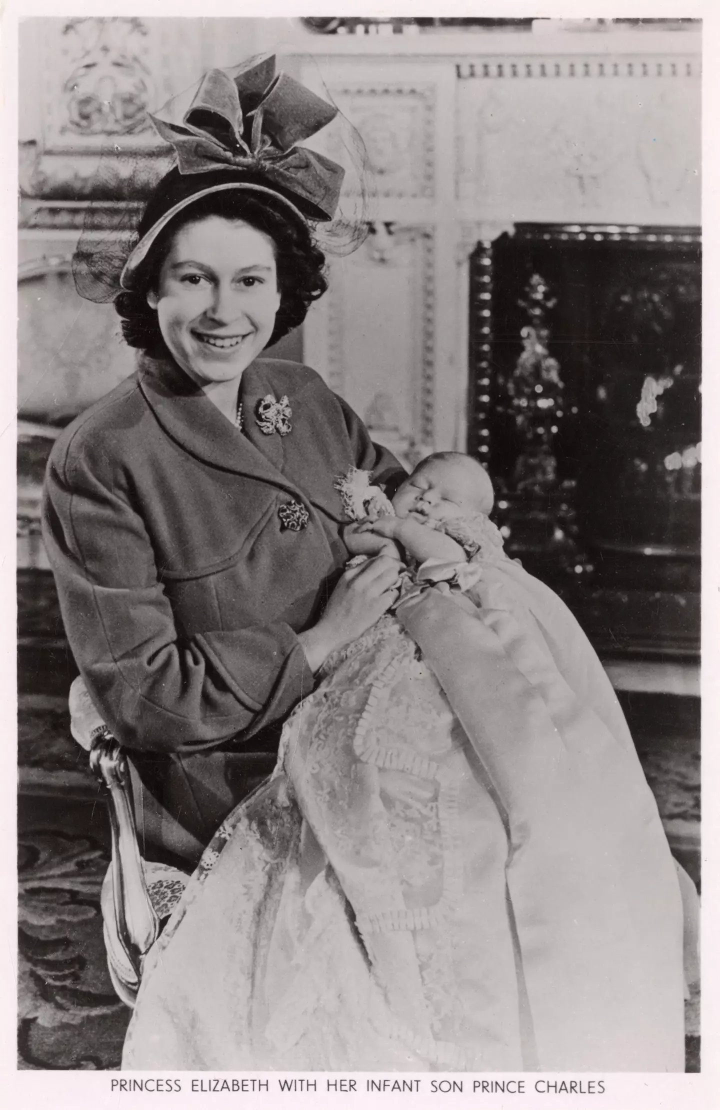Queen Elizabeth and newborn Charles.