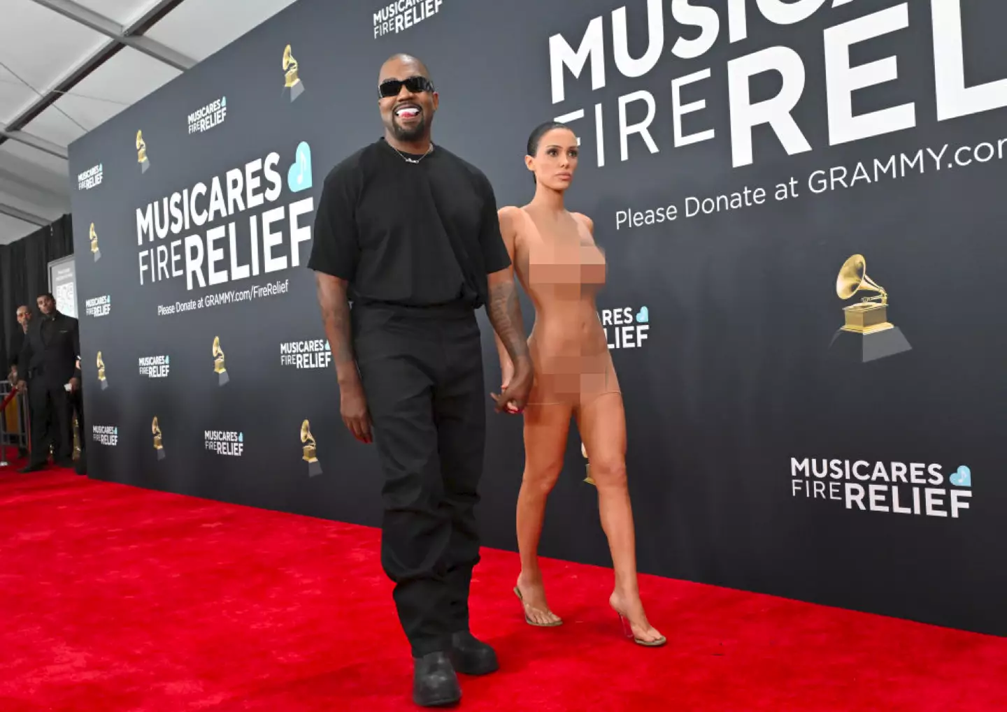 Kanye West and wife Bianca Censori caused raised a lot of eyebrows on the Grammys red carpet for obvious reasons (Axelle/Bauer-Griffin/FilmMagic)