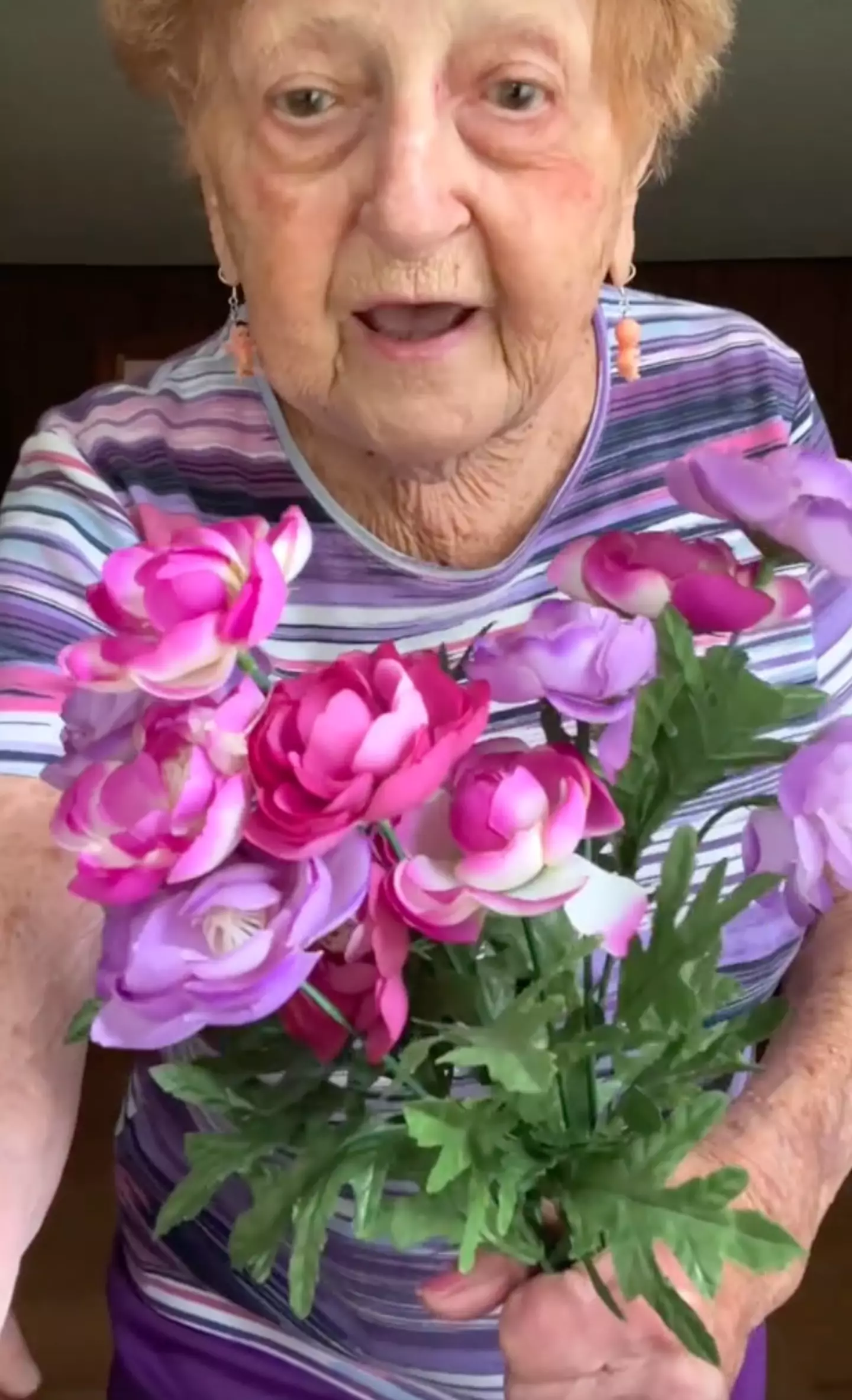 She wore baby earrings because he 'cried like a baby' when she dumped him. TikTok/@grandma_droniak