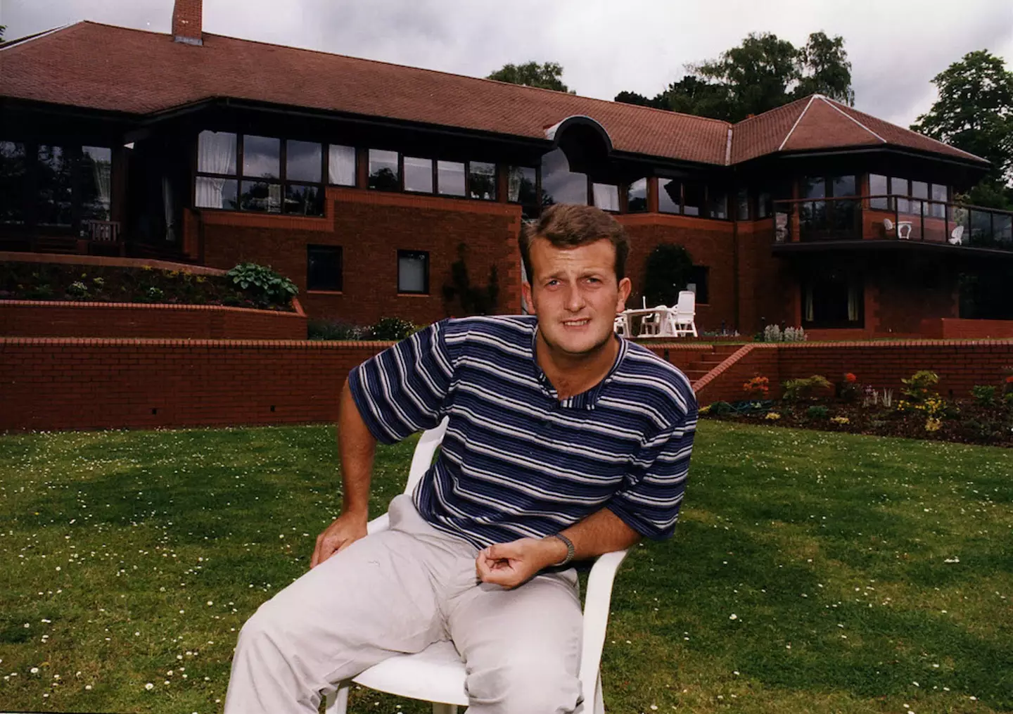 John in front of his South Lanarkshire home.