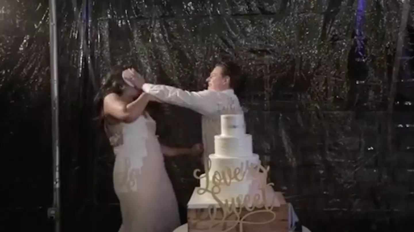 The couple were just about to enjoy their first slice of wedding cake.