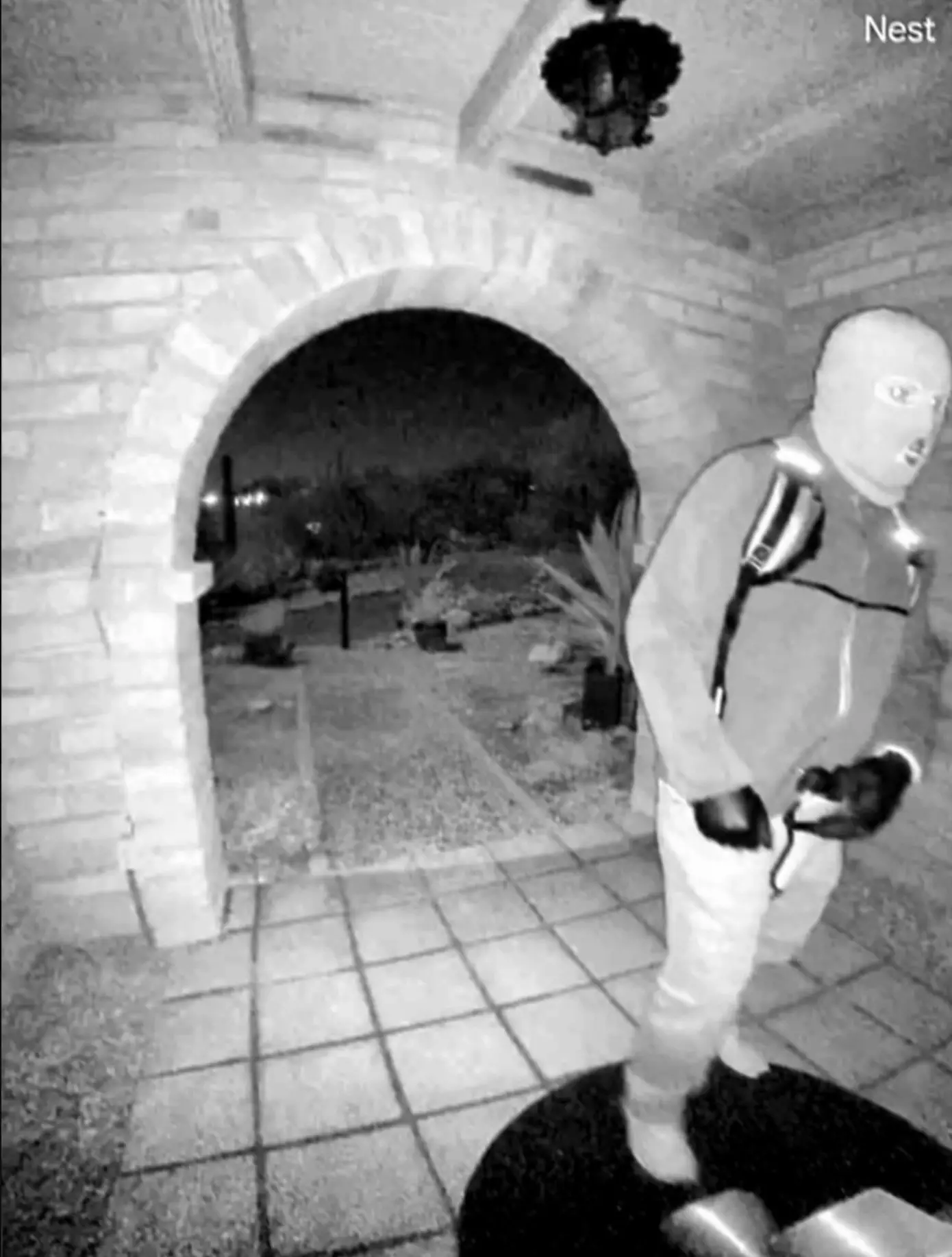 Officials have released images of an 'armed' individual seen 'tampering' with her doorbell camera on the morning she vanished (FBI)