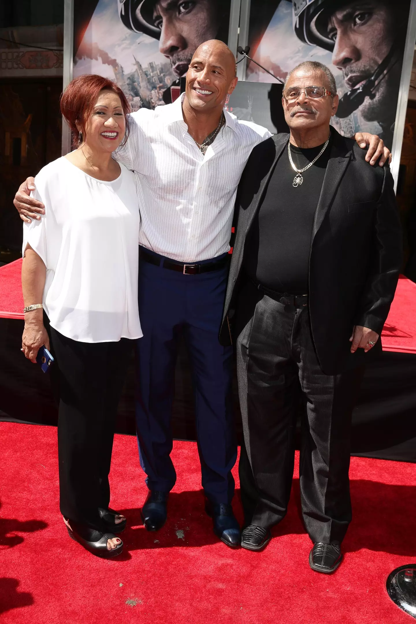 The Rock said his dad wasn't 'an inspiration in terms of his tenderness', and he was raised with 'a tough and complex love' (Eric Charbonneau/Getty Images for Warner Bros.)
