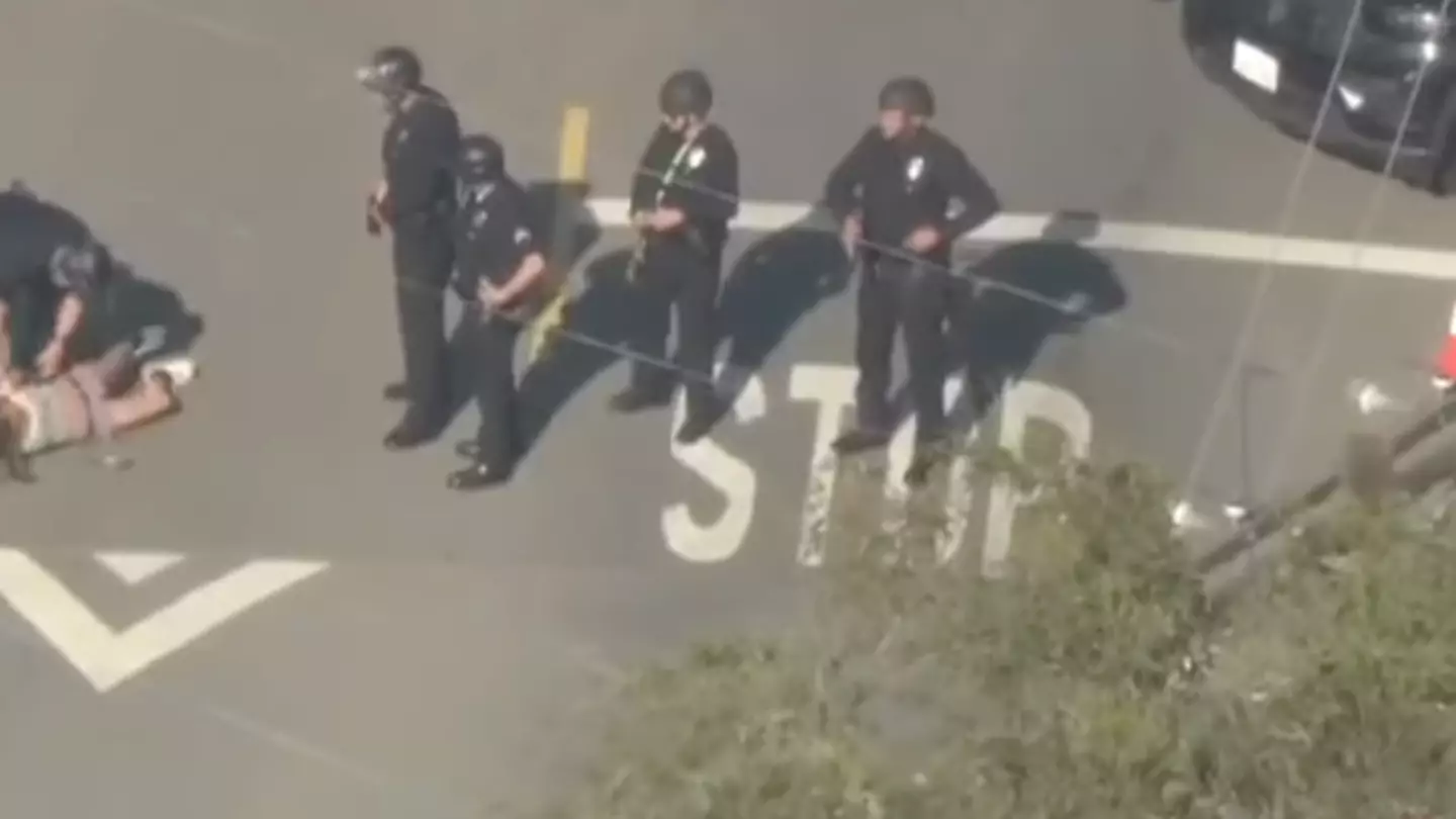 Footage shows police approaching the wife of Weezer's bassist as she was shot after pointing a gun at them