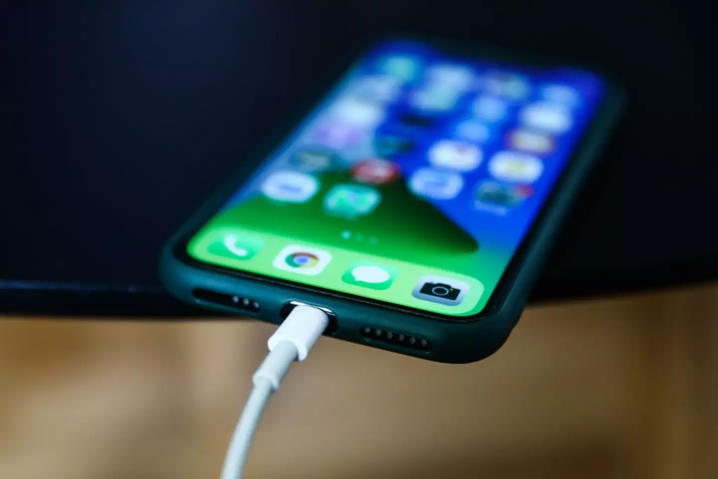 Apple has warned iPhone users that charging their phones overnight could result in injury (Getty Stock Images)