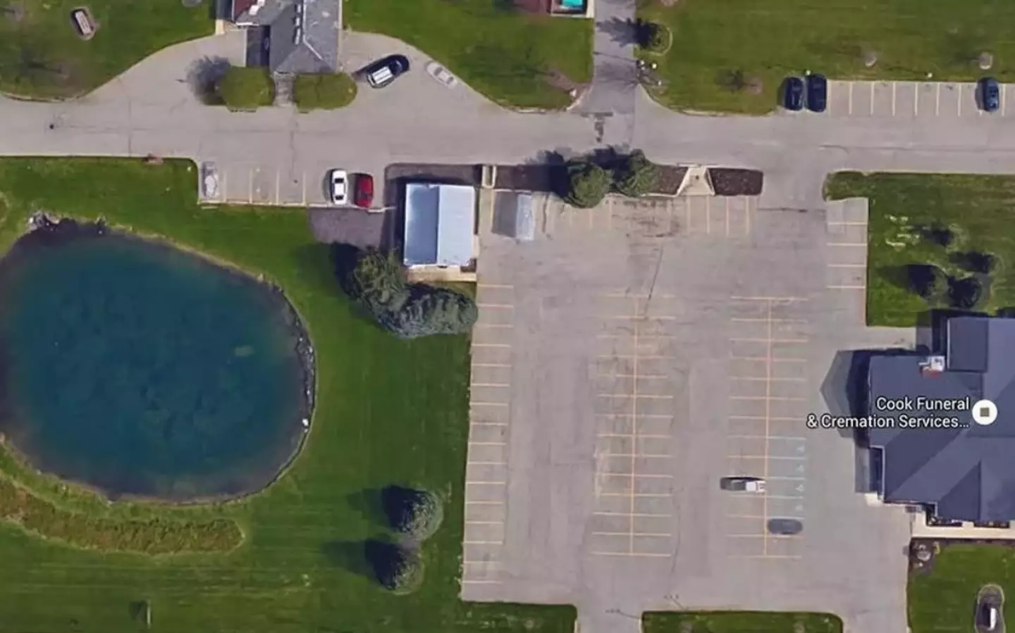 The car can just about be seen under the water. (Google Maps)