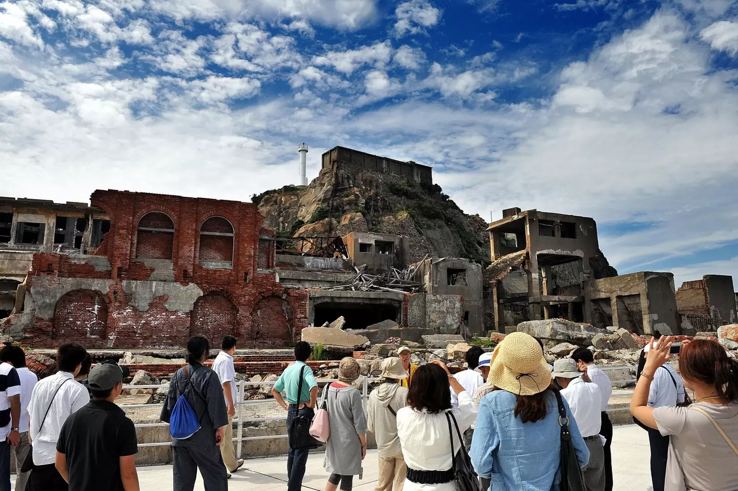 Tourists now flock to Japan to visit the derelict island (Sankei/Getty Images)
