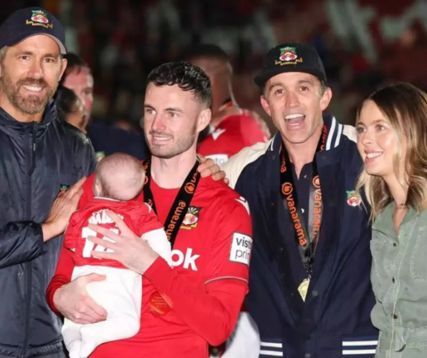 Ryan Reynolds and Ryan McElhenney with Anthony Forde, his wife Laura and his son Paddy after Wrexham won the National League title.