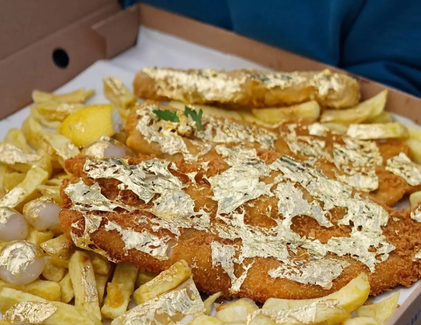 The dish has 24 karat gold sprinkled all over it.