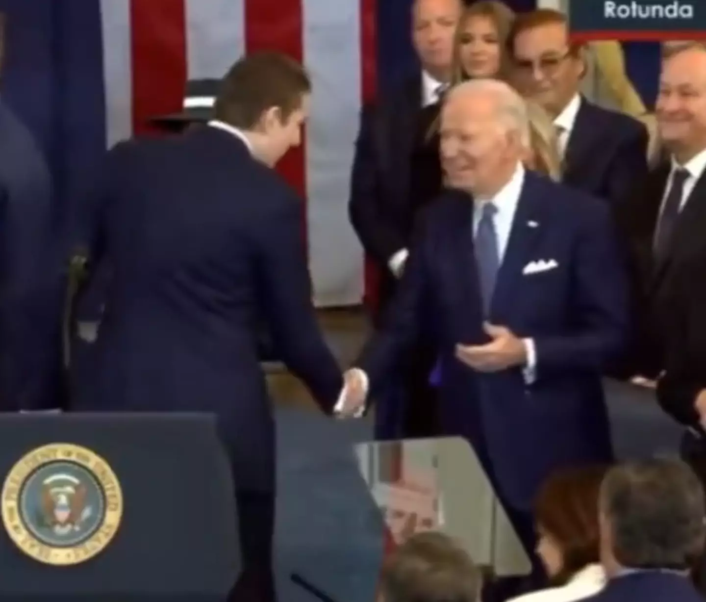 Barron shook hands with Joe Biden before appearing to make a comment in the former President's ear (X)