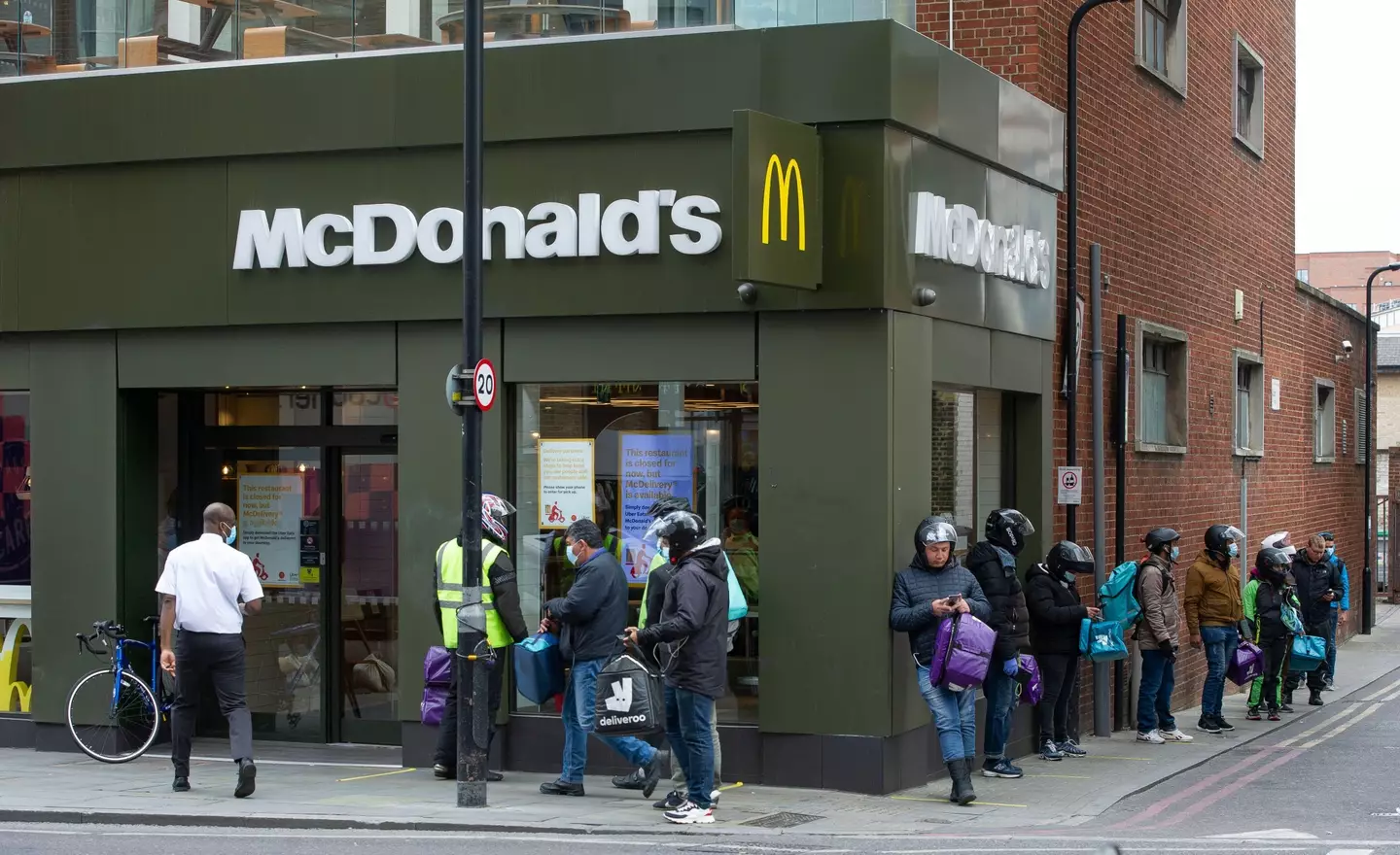 While Imran was stood waiting, McDonald's workers were reportedly 'rushing' to get delivery drivers' orders ready.