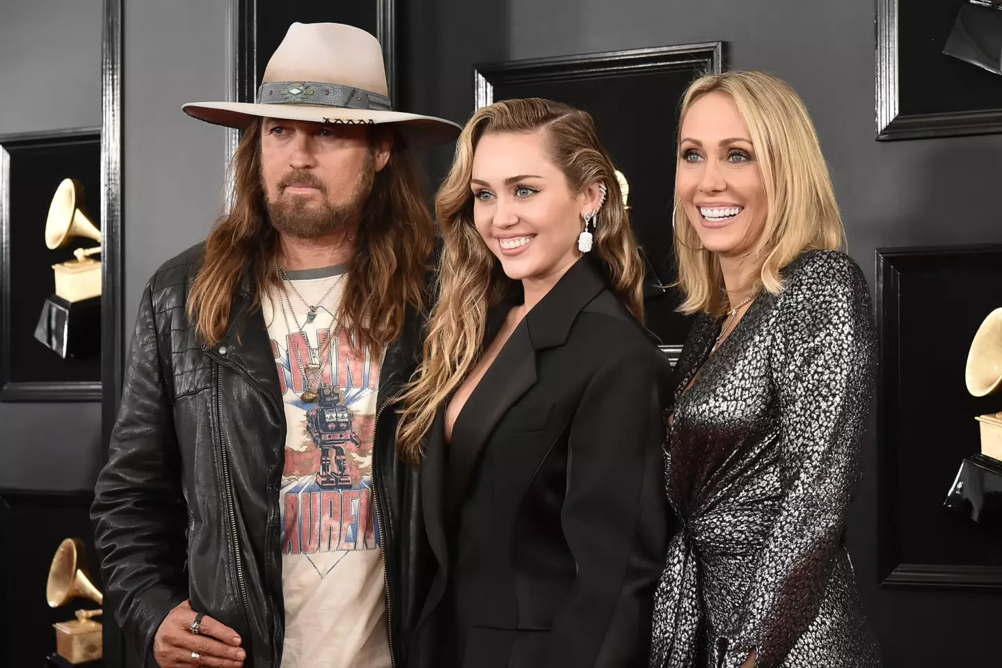 Miley Cyrus pictured with her parents Billy Ray and Tish in 2019 (David Crotty/Patrick McMullan via Getty Images)