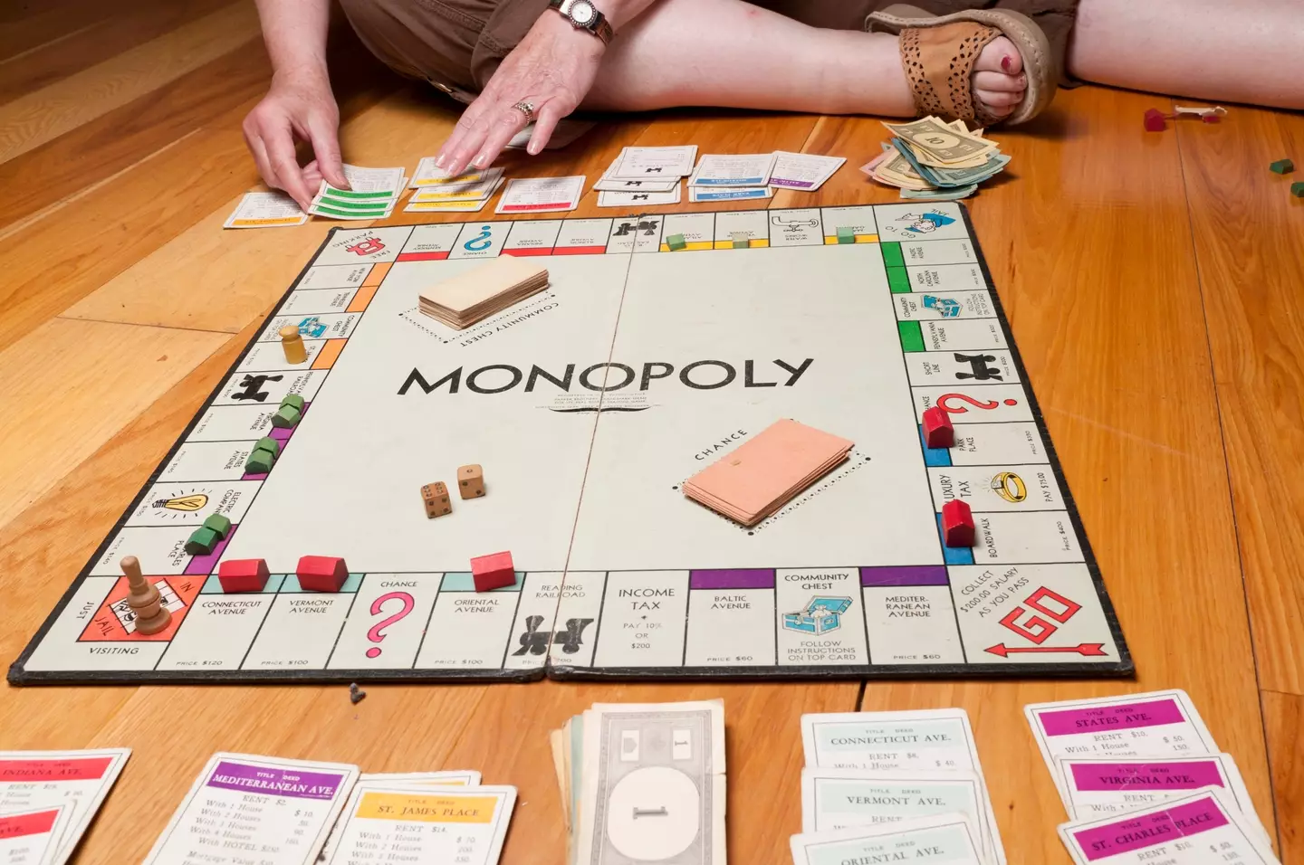There's nothing like sitting around the Monopoly board arguing with your family. (Bruno Vincent/Getty)