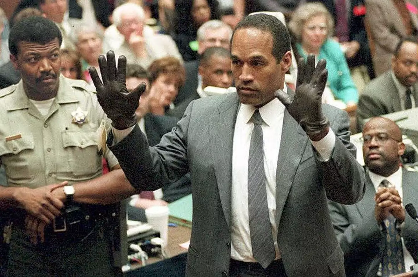 The scene is a parody of the famous OJ Simpson glove moment (VINCE BUCCI/AFP via Getty Images)