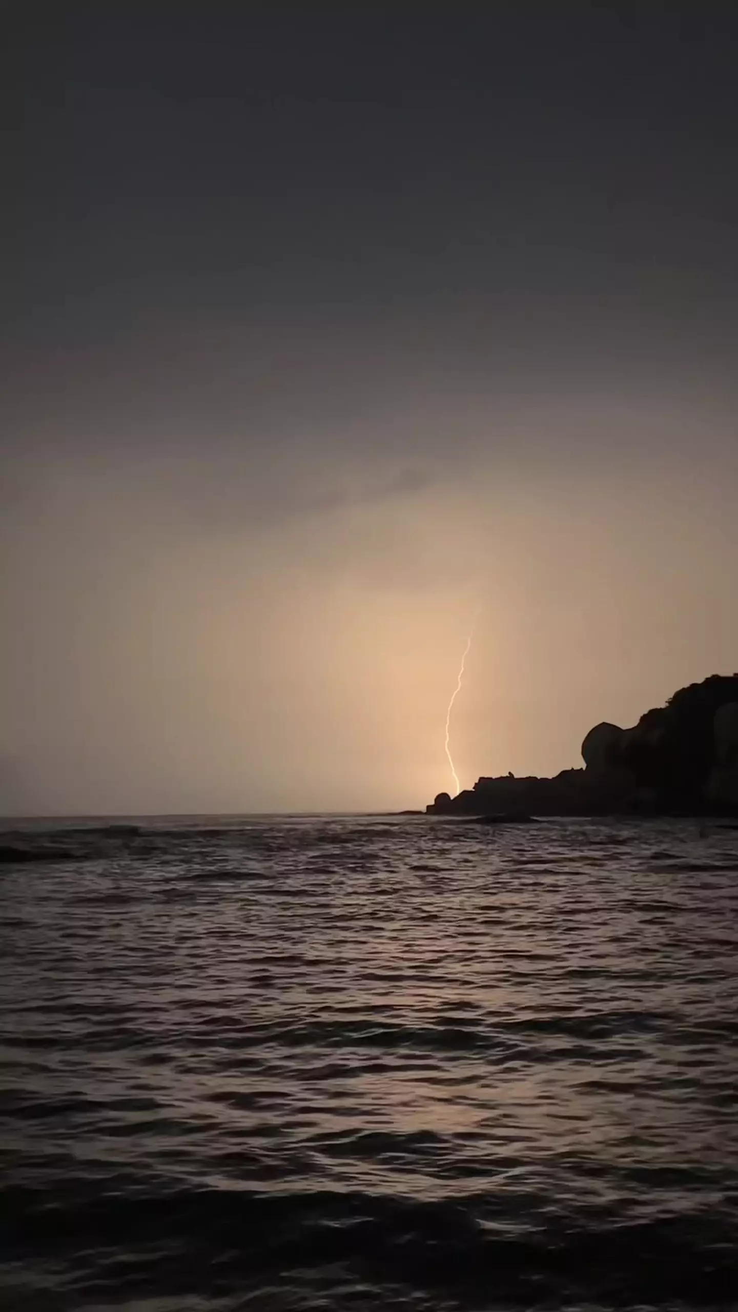 Lightning bolts could be seen striking the sea in the distance (Kennedy News and Media)