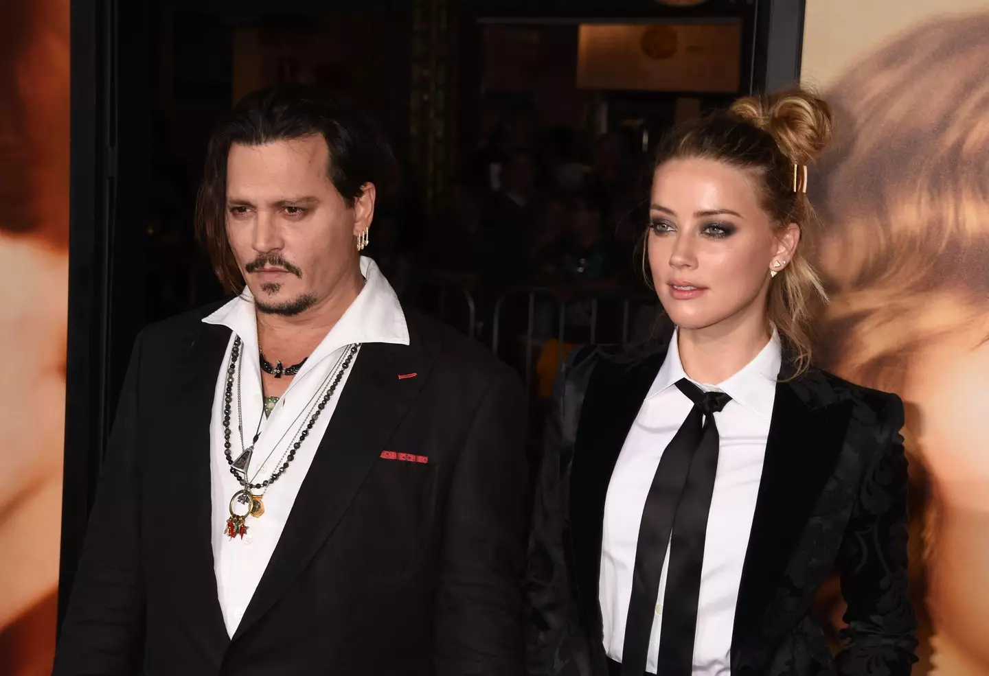 Actor Johnny Depp and wife/actress Amber Heard arrive at the premiere of Focus Features' "The Danish Girl" at Westwood Village Theatre on November 21, 2015 in Westwood, California.