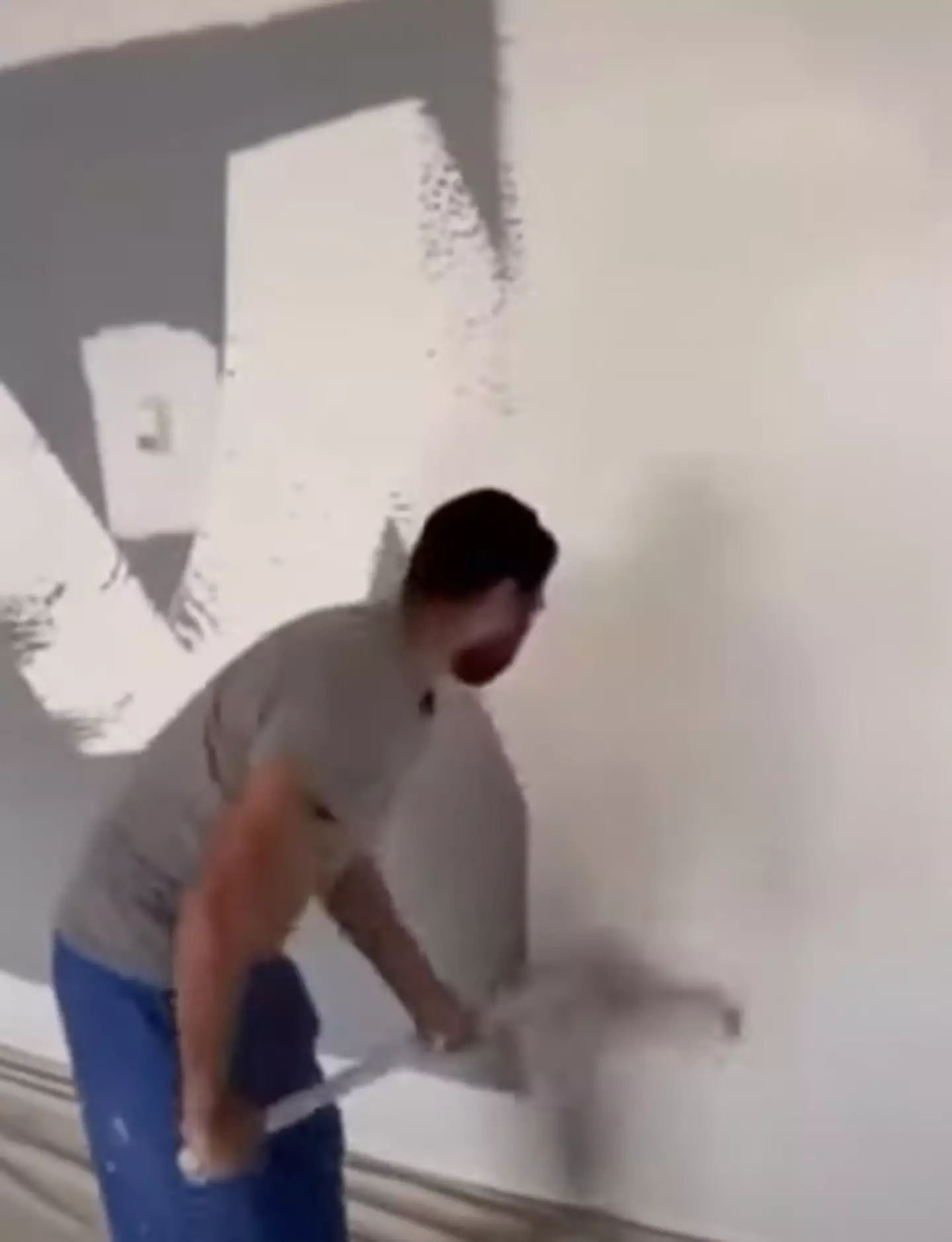 The man painted a wall in under a minute.
