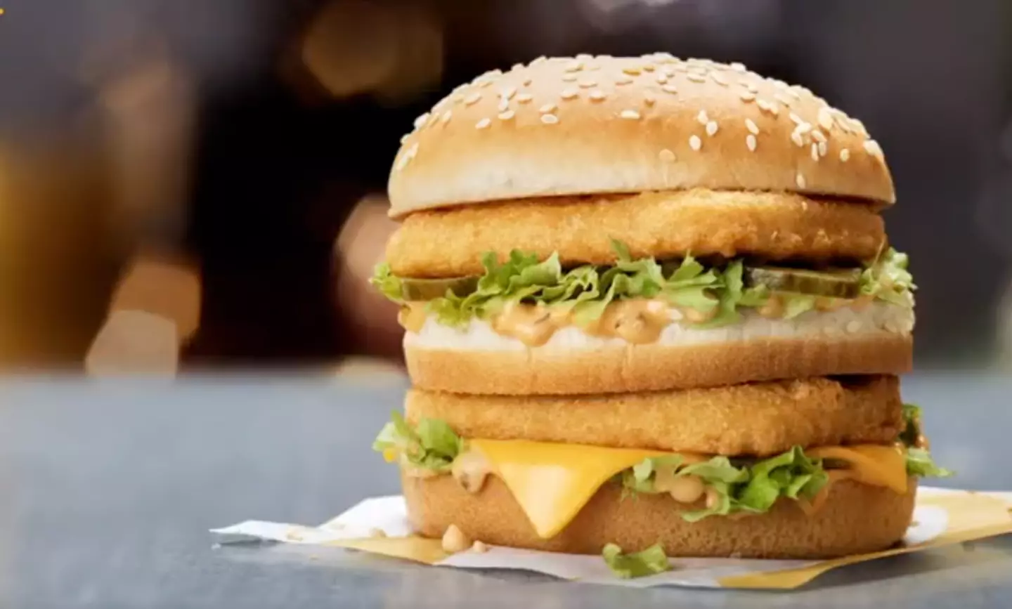 It features a triple layered bun and two 100 percent chicken breast patties.