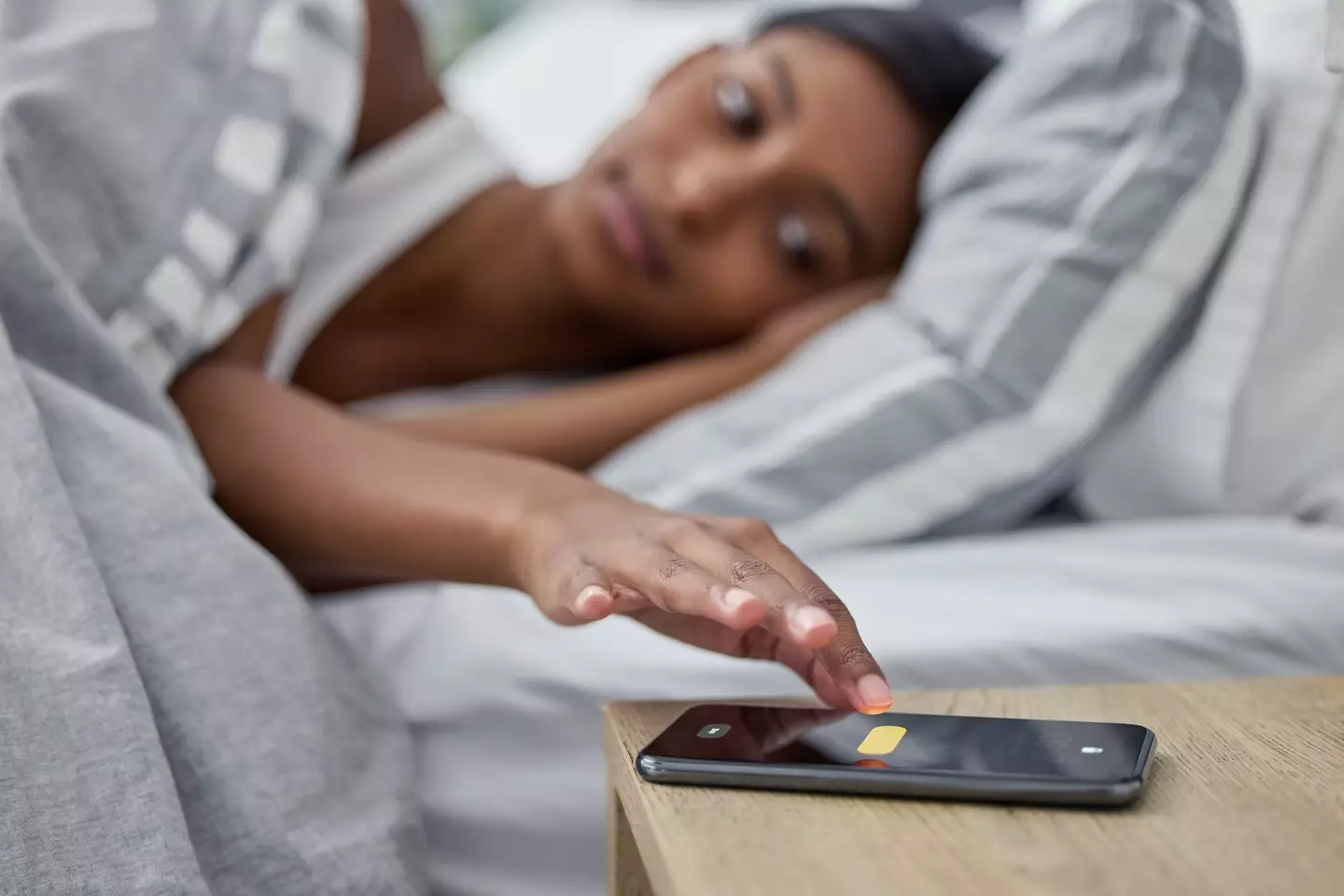 No! Don't touch that snooze button! It's the enemy! (Getty Stock Photo)