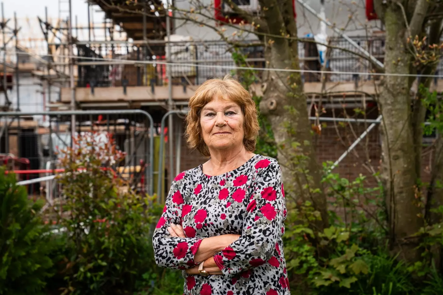 Martine Le Barth and her husband say they were 'flabbergasted' to discover two-storey houses built around their bungalow (SWNS)