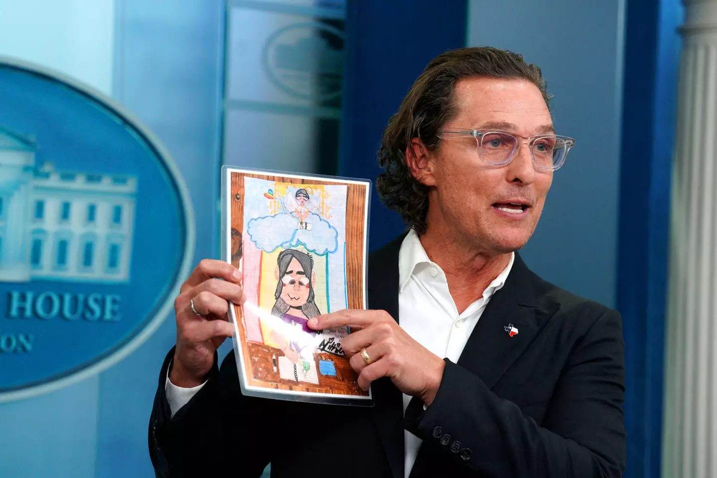 McConaughey with the drawing by 10-year-old victim Alithia Ramirez.