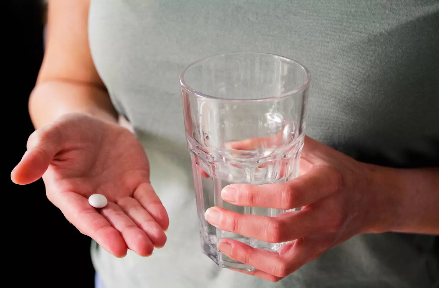 A bit of water and something to take the pain away should sort out your hangover, it won't make alcohol poisoning go away. (Getty Stock Photo)