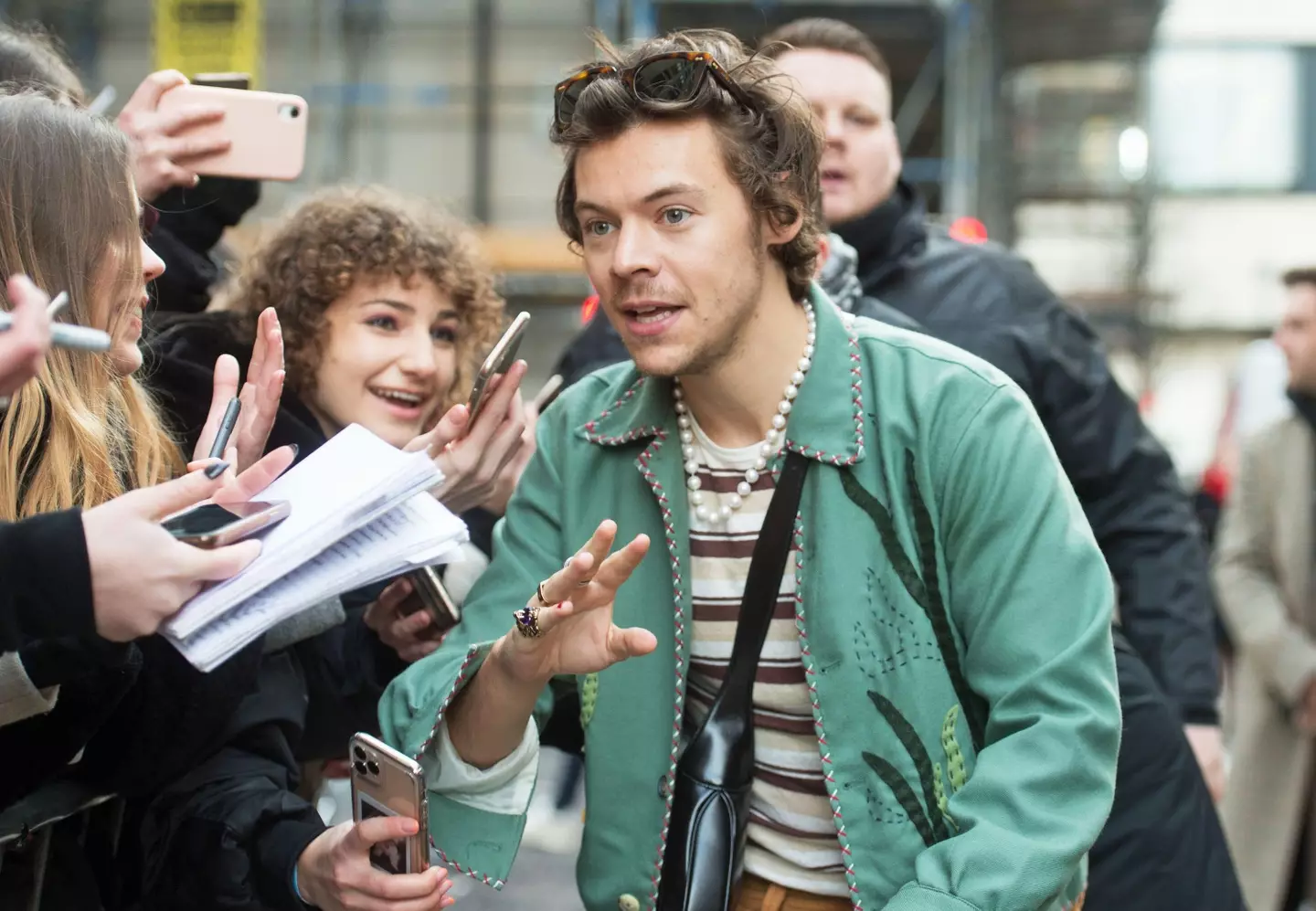 Harry Styles speaks with fans as he leaves the BBC Radio studios in London, after an appearance on Radio 2's The Zoe Ball Breakfast Show.