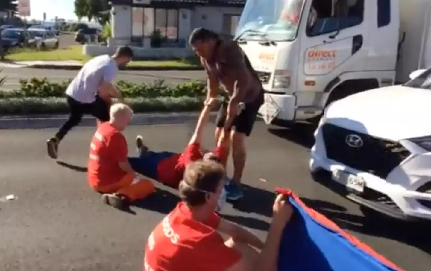 An angry motorist was seen dragging a Fireproof Australia protester across the road.