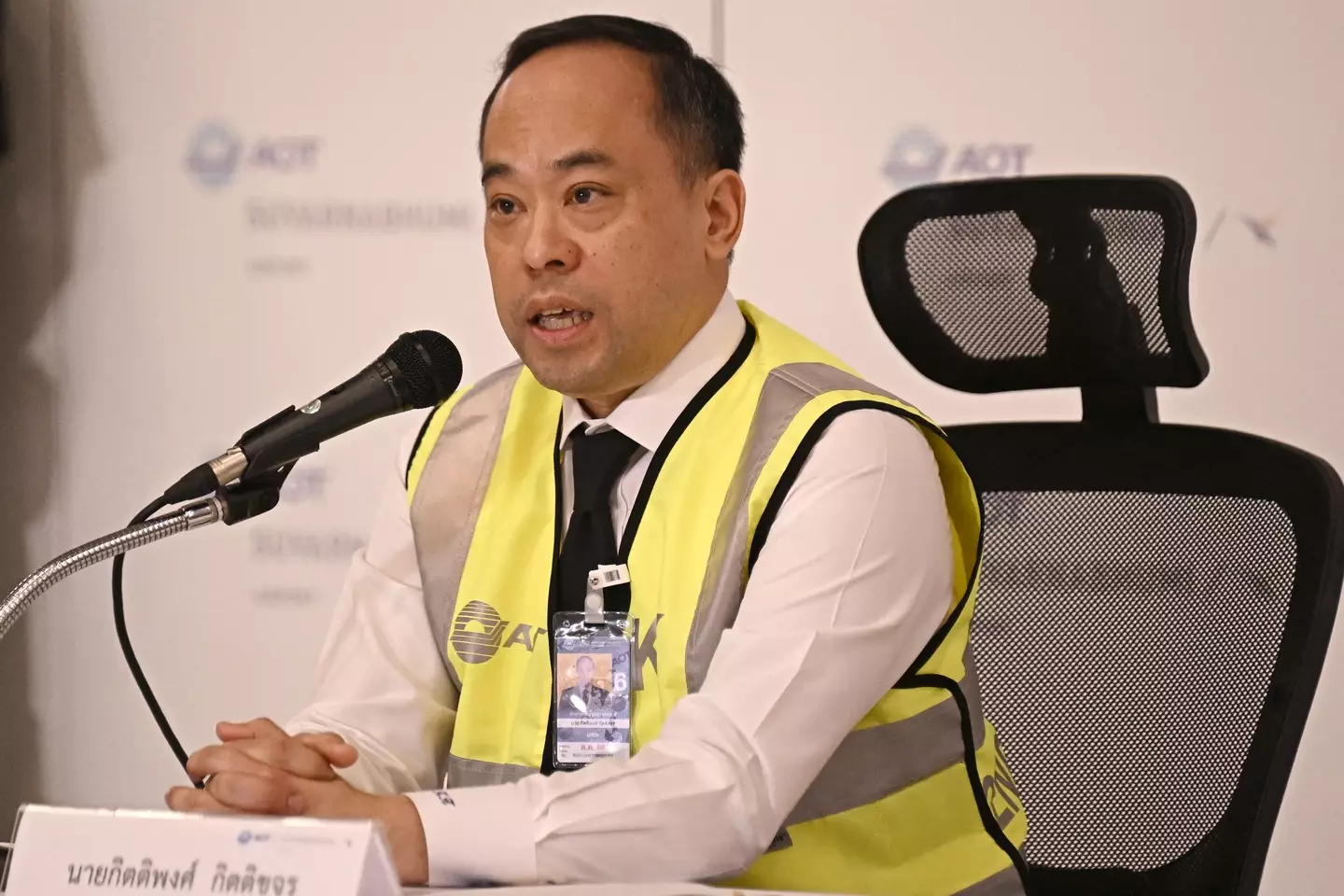 Airport director Kittipong Kittikachorn updated people on the status of the plane and the person who died. (LILLIAN SUWANRUMPHA/AFP via Getty Images)