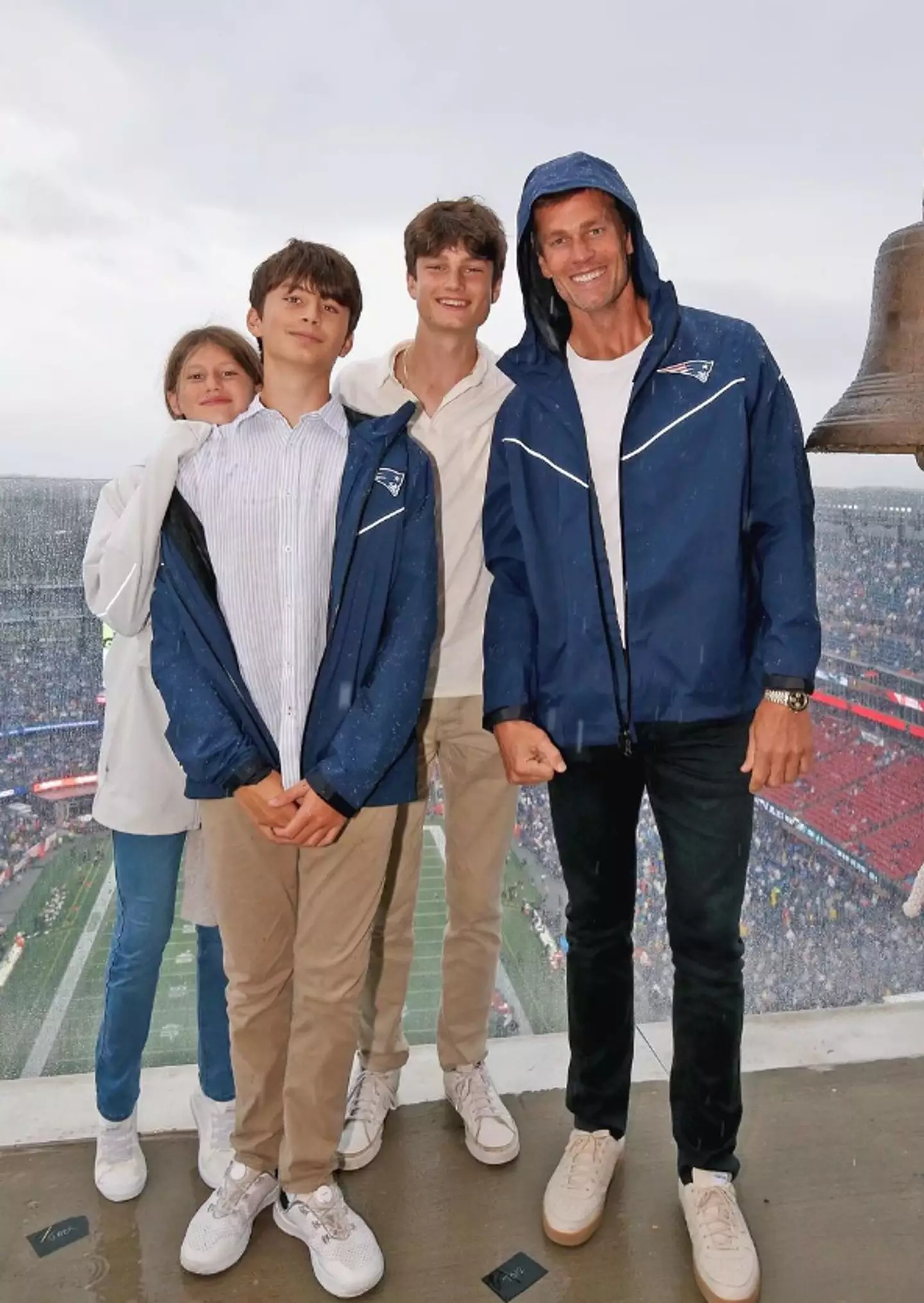 Brady and his kids at a New England Patriots game.