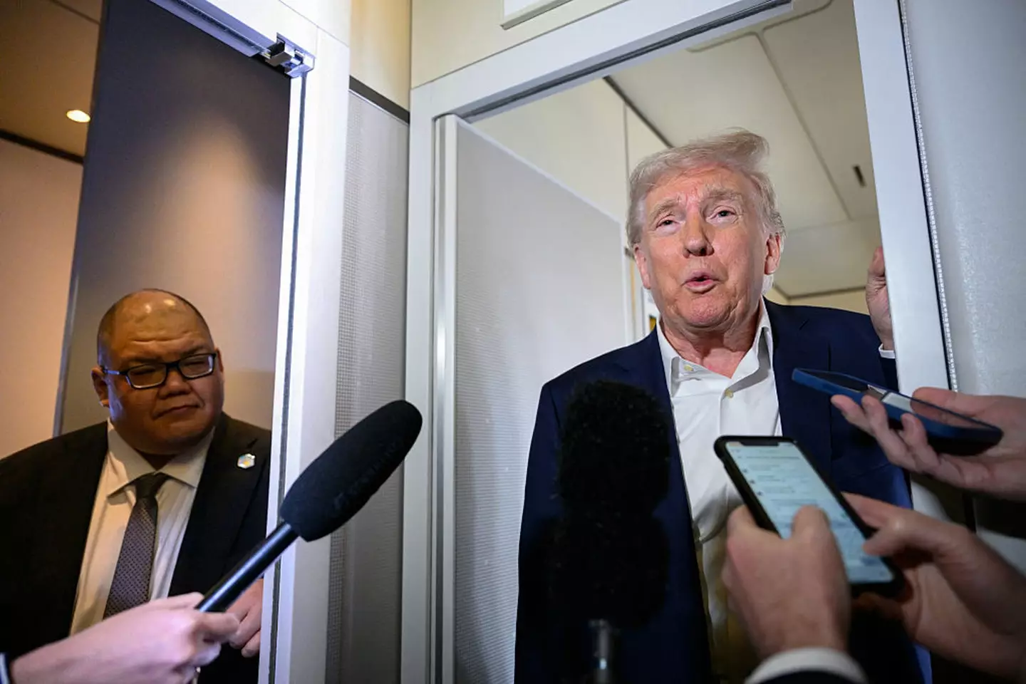 White House Communications Director Steven Cheung (left) said Trump had 'unprecedented accomplishments' (MANDEL NGAN/AFP via Getty Images)