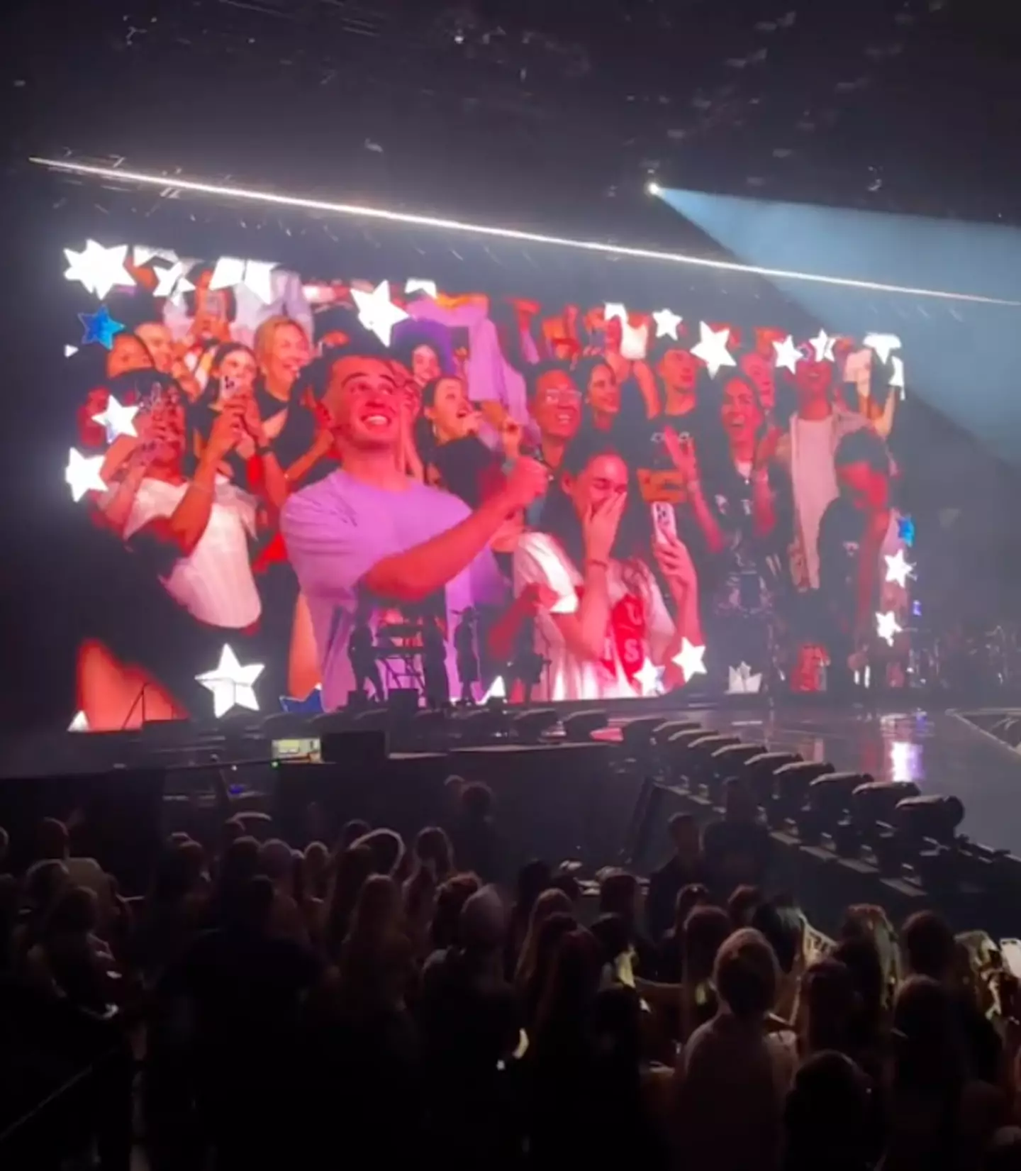 Not quite the kiss cam she was hoping for. (TikTok/@tjsant06)