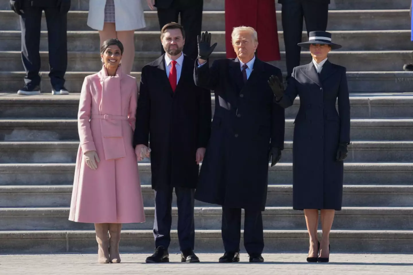 The body language expert explained that Trump had a better exchange with JD Vance's wife (CHRIS KLEPONIS/POOL/AFP via Getty Images)