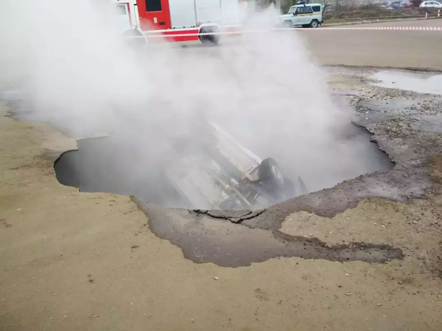 The sinkhole had flipped the car upside down and the men were trapped with no way of escaping.
