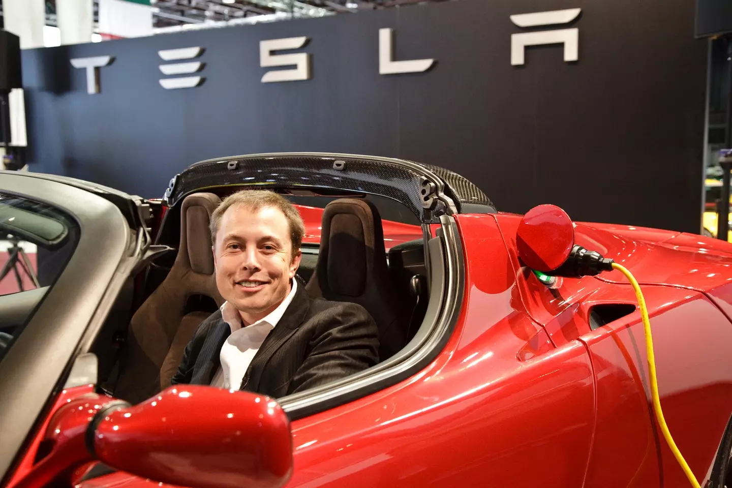 Musk in a Tesla Roadster back in 2009 when it launched (James Leynse/Corbis via Getty Images)