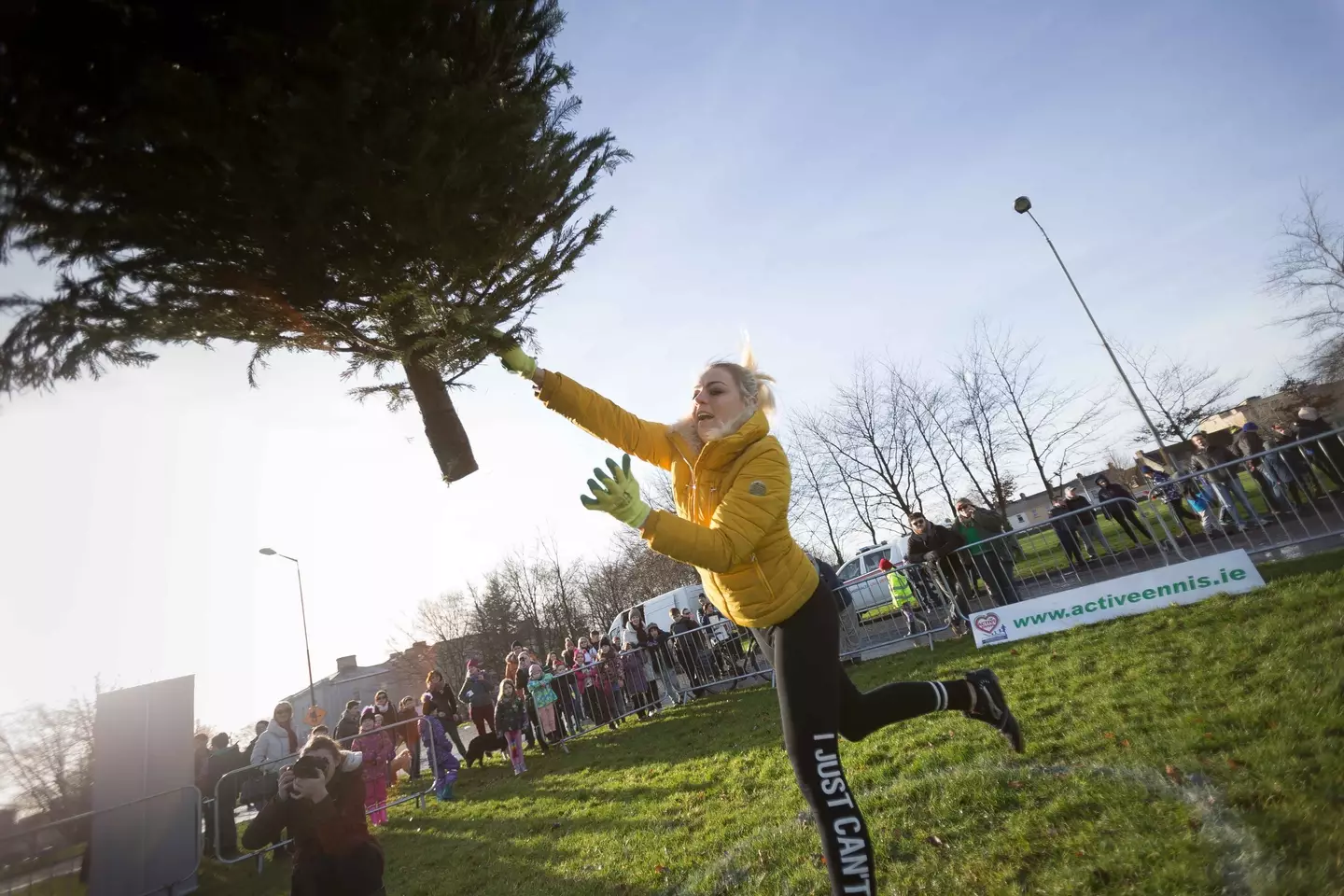 She claimed she was in serious and constant pain due to her injuries, but she was able to win a Christmas tree throwing competition.