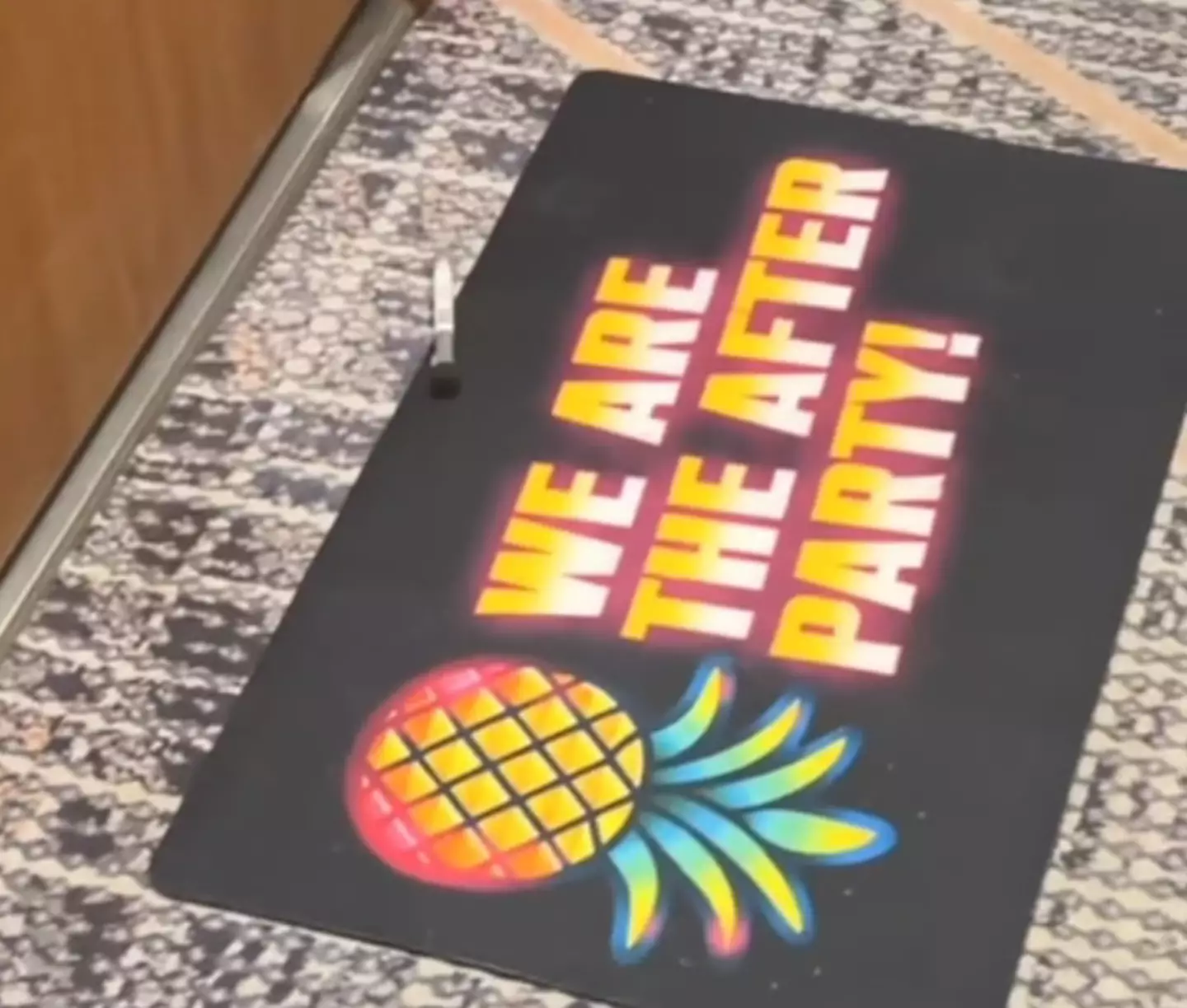 Pineapple doormat. If you know, you know.