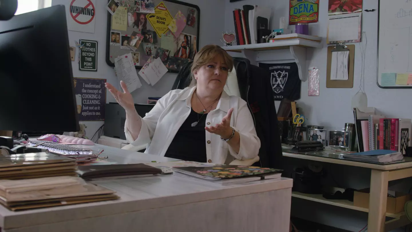 Dena is the Madame of a legal mega brothel (ZANDLAND)