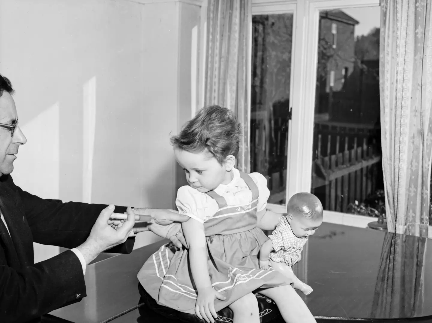A child receives a polio vaccine in 1959.