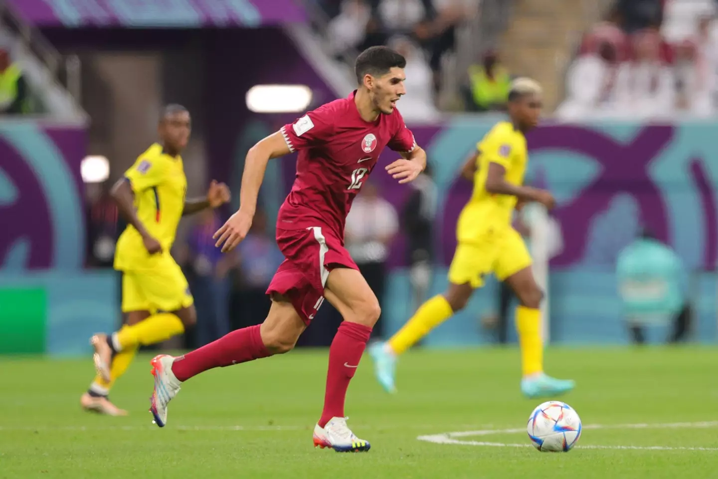 Karim Boudiaf of Qatar dribbles the ball during the FIFA World Cup Qatar 2022 Group A match between Qatar and Ecuador.