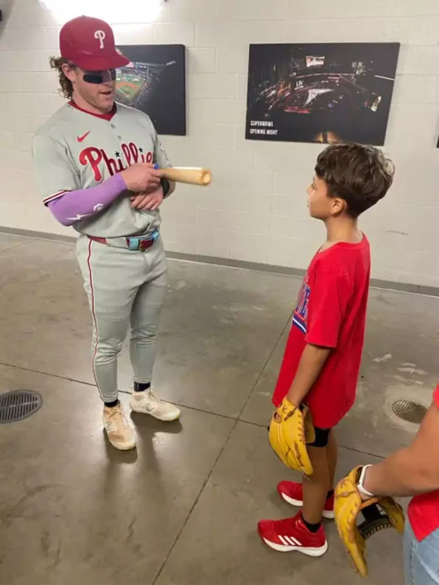 Phillies outfielder Harrison Bader gave the boy a signed bat after the game (X/@Phillies)