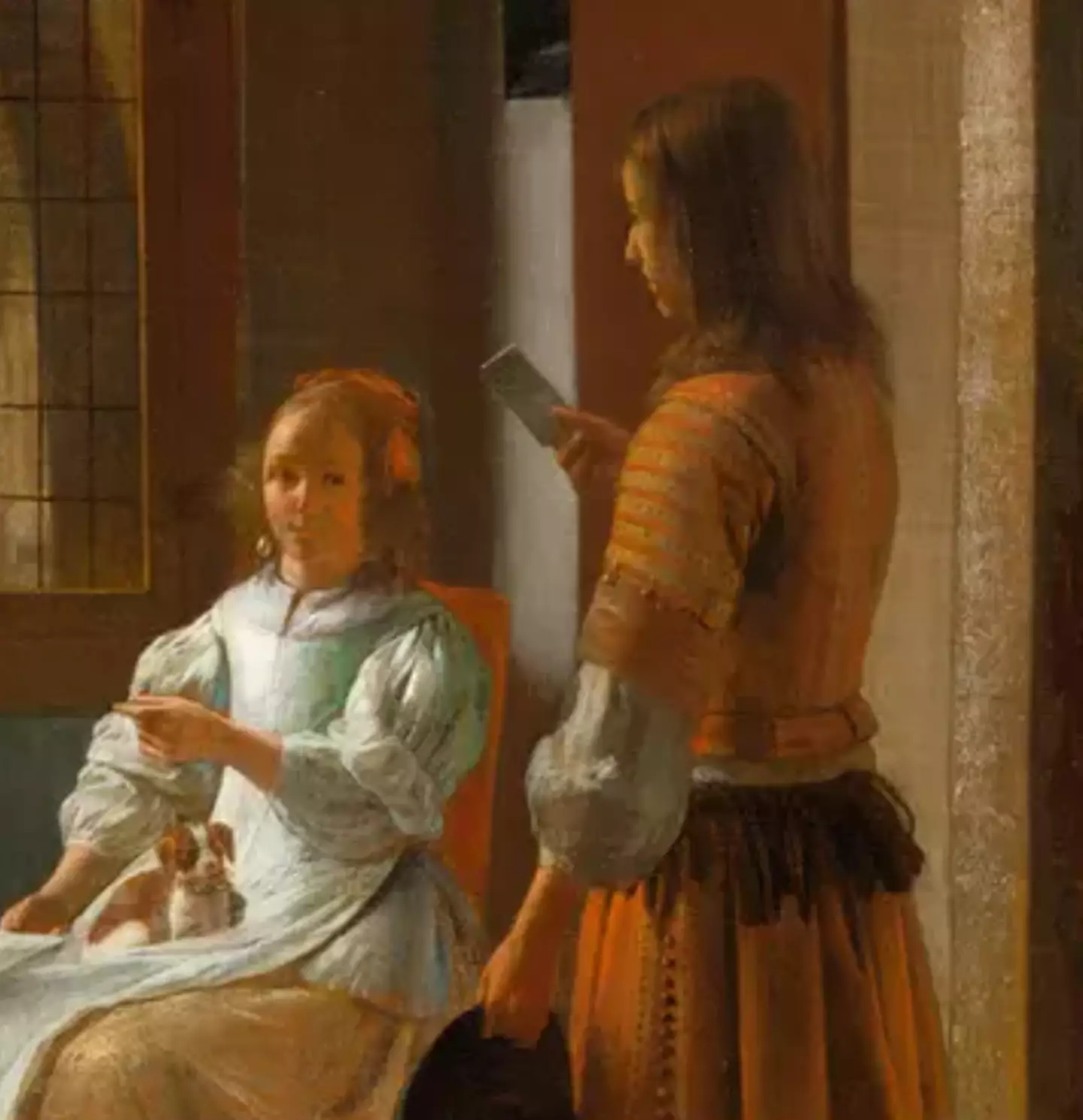 People have been left well and truly baffled after noticing an 'Apple phone' in a 350-year-old painting.