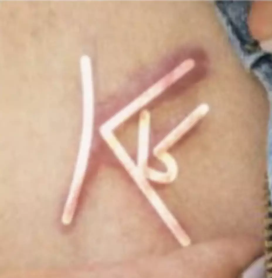 The image incorporated Raniere's initials (CBS)