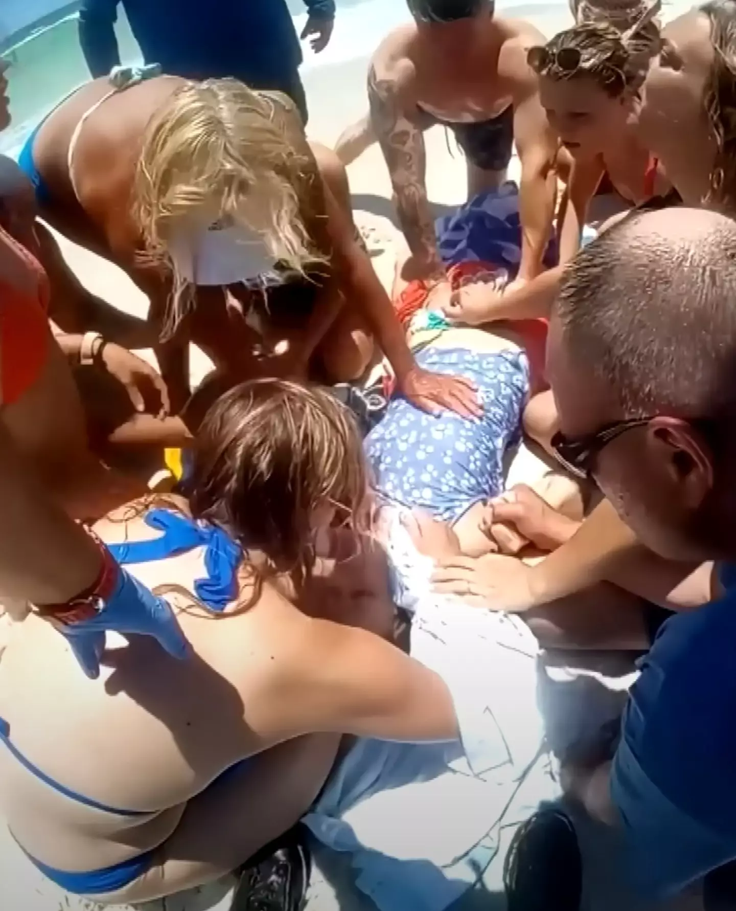 Bystanders rushed to the mum's aid and saved her life after her husband hauled her back to shore (Inside Edition)